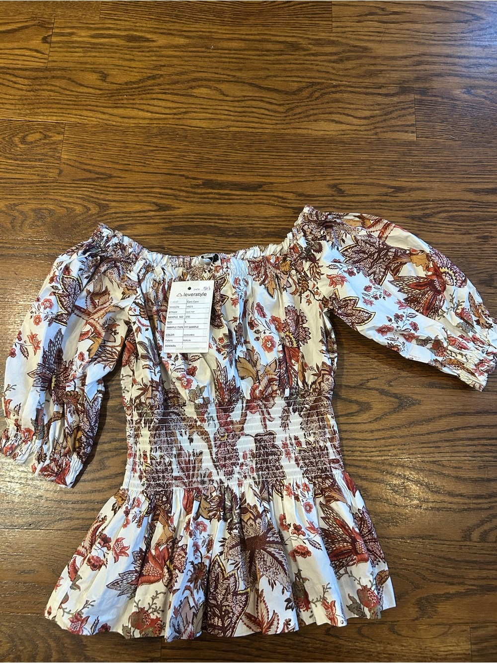 Cara Cara White Floral Off-Shoulder Smocked Peplum Top